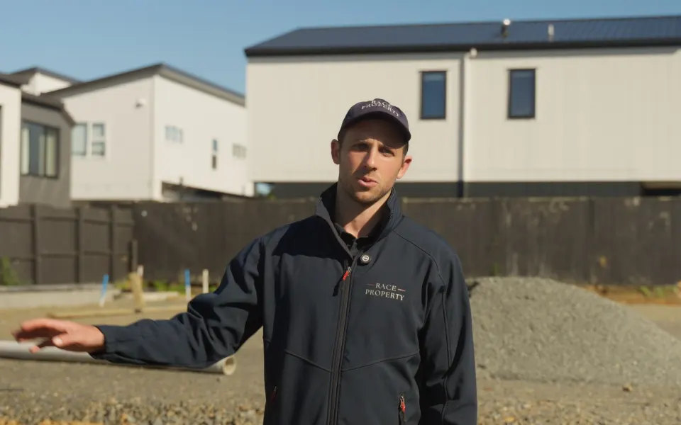 Race Property founder speaking to camera on a Beach Haven build site